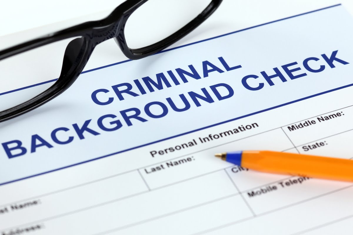 A criminal background check form with incarceration records.