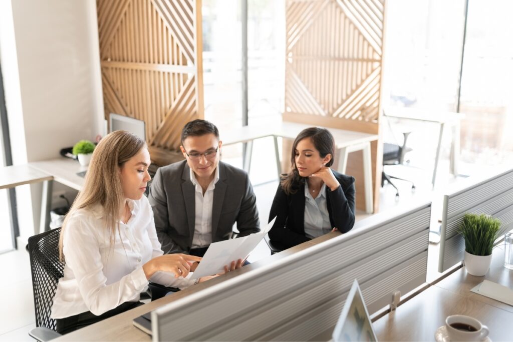 A group of business people collaborating in an office on case briefs.